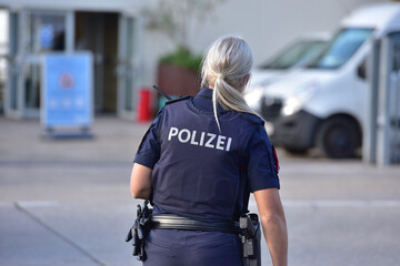 Policewoman in Austria from behind