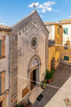 The facade of the ancient church of San Giovanni Battista in the historic center of Collevalenza or Colvalenza, Perugia, Italy