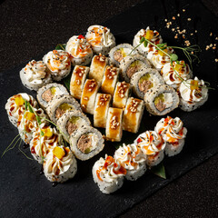 tasty sushi on the black background