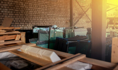 warehouse with new glasses for cars, windshields in wooden containers.
