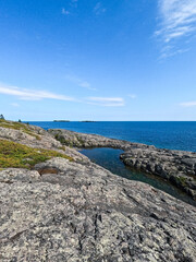 Unspoiled Views of Lake Superior and Natures Beauty. Standing on a rock basin at the Northern most edge of the United States, looking out over the vast expanse of Lake Superior. Isle Royal NP.