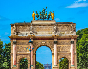 Fototapeta na wymiar Arc de Triomphe du Carrousel, Place du Louvre, Paris, France. Built by Napoleon in 1808 to celebrate Victory at Austerlitz, Background Obelisk Place de Concorde and Arch de Triomphe.
