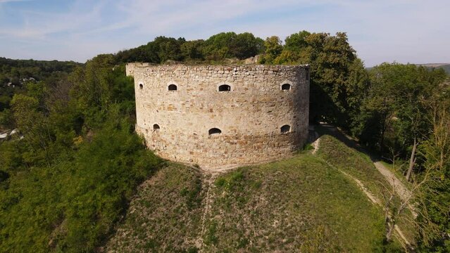 Aerial footage drone flies forward to ruined 17th-century castle in the town of Terebovlia in western Ukraine