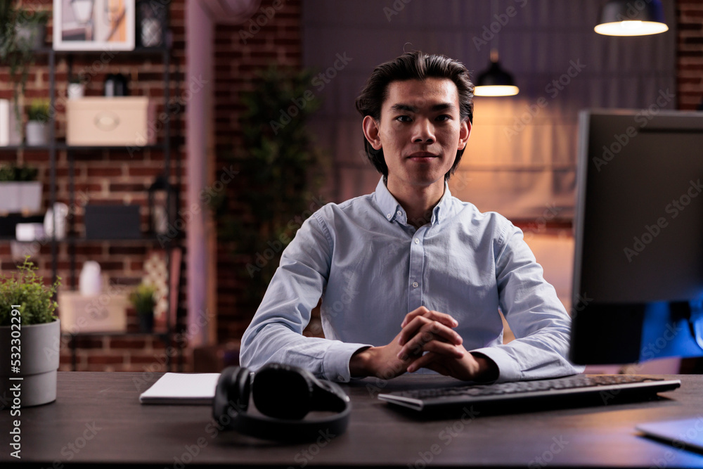 Poster asian man working remotely on computer, using online research information on website to plan busines