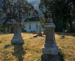 Fototapeta na wymiar A vintage country church with cenetery in the Spring Valley area near Salem Oregon