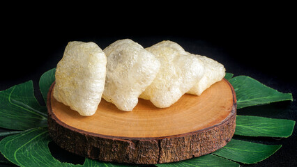 Crispy cracker snack made from fried cow's skin. Kerupuk Kulit one of Indonesian traditional crackers. Selective Focus