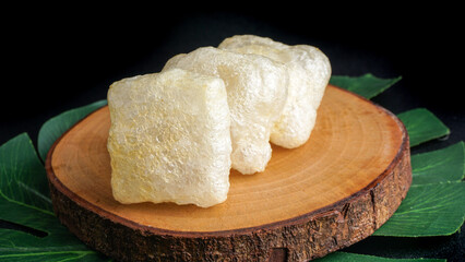 Crispy cracker snack made from fried cow's skin. Kerupuk Kulit one of Indonesian traditional crackers. Selective Focus