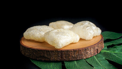 Crispy cracker snack made from fried cow's skin. Kerupuk Kulit one of Indonesian traditional crackers. Selective Focus