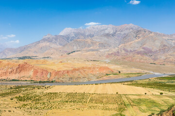 Anjirob-I Bolo, Khatlon Province, Tajikistan. Large mountains and the Panj River valley.