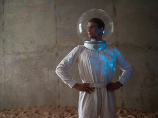 Heroic astronaut in a retrofuturism-style spacesuit on a desert planet, a hologram of star systems on his helmet. discoverers of new worlds, science fiction