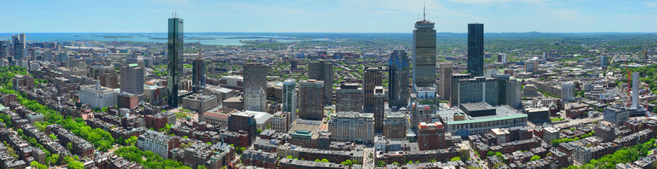 Boston Back Bay modern city skyline including John Hancock Tower, Prudential Tower, and Four Season Hotel at One Dalton Street in Boston, Massachusetts MA, USA.  
