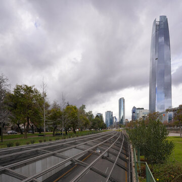 Traffic on highway in front of Costanera center in Santiago, Chile during stormy winter day 