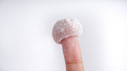 Mochi, Japanese Dessert hold by hands. In Indonesia Popular as Moaci or Mochi Sukabumi. Selective Focus