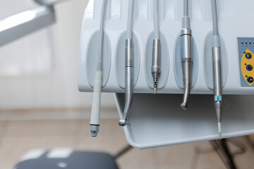 Close-up of a tool box in a dental chair with dental attachments