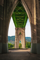 The arching geometry under the St. John's Bridge in Cathedral City Park in Portland