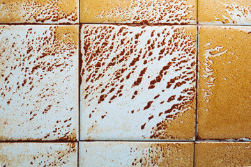 abstract wet rust scattering on a tile background