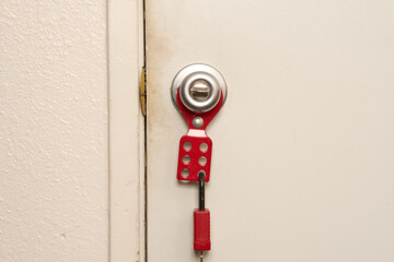 lockout/tagout attached to doorknob with lock attached