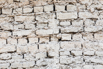 Margib, Sughd Province, Tajikistan. Mud brick wall on a home in a mountain village.