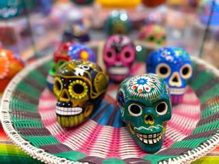Fototapeta na wymiar Colorful ceramic skulls. Day of the dead concept. Mexican traditional holiday