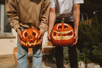 Funny halloween pumpkins in hands