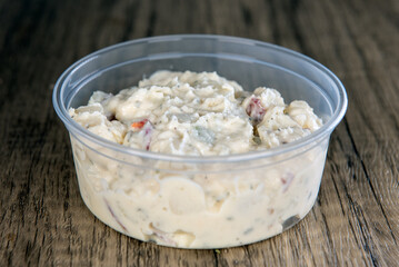 Lunch is complimented with a side order of  German Potato salad in a resuable container - obrazy, fototapety, plakaty