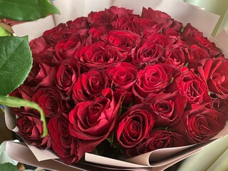 bouquet of red roses on the table