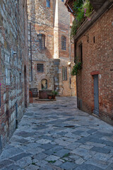 Italy, Tuscany, Montepulciano. Cobblestone street in the hill town of Montepulciano.