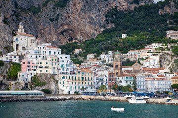 Fototapeta na wymiar Italy, Amalfi. The coastal town of Amalfi as seen from a boat in the harbor.