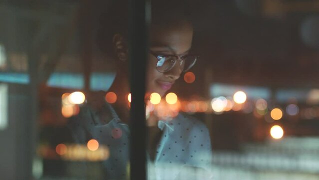 Innovation business woman working at night in office with digital tablet, glasses and bokeh for online review, seo analytics or global marketing. Motivation, goal and success manager check web design