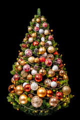 christmas tree with golden and red balls on black background
