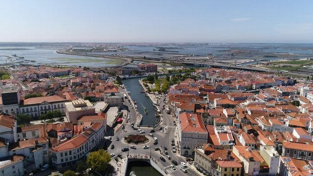 Aerial View City Center of Aveiro Portugal 4k. Aveiro aerial cityscape. Tourists enjoying tour on moliceiros, tradition boats of Ria de Aveiro. Venice of Portugal. Travel Destination.