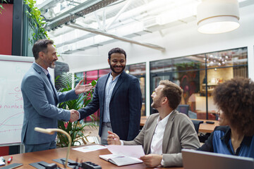 Business male partnership handshake. Photo handshaking process. Successful deal after meeting