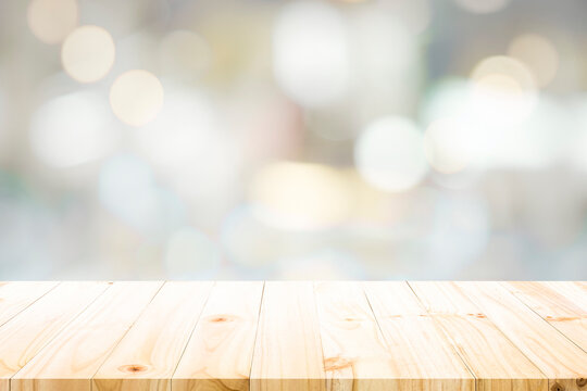 Empty wooden table for present product on bokeh blur background image.