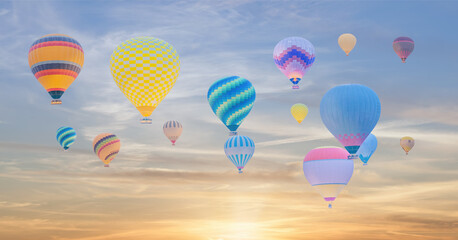 Fototapeta na wymiar multi color hot air balloon over sunrise sky