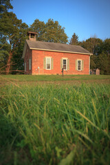 Old brick one room schoolhouse with grassy yard in Ohio 