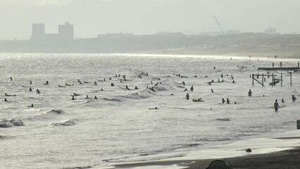 FUJISAWA, KANAGAWA, JAPAN - AUGUST 2022 : View of Enoshima beach (sea) at Shonan area in sunset. Romantic, moody sky in dusk. Japanese hot summer holiday (vacation) season concept video.