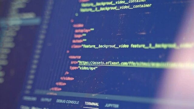 Code for a website is scrolled upward in an IDE as a programmer finds the line to insert lines to debug a recent change in a security model