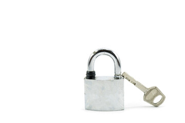 Fototapeta premium Used silver locked padlock with key Isolated on white