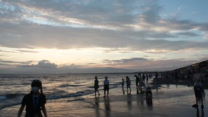 FUJISAWA, KANAGAWA, JAPAN - AUGUST 2022 : View of Enoshima beach (sea) at Shonan area in sunset. Time lapse shot, dusk to night. Japanese hot summer holiday (vacation) season concept video.