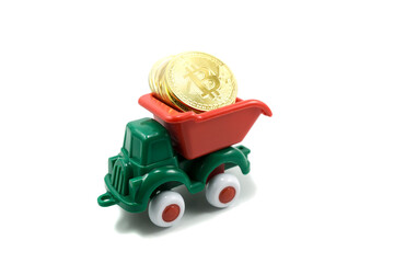 green paint plastic toy mining truck carrying bitcoin gold coins