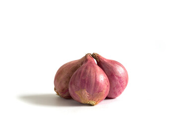 Three red onions isolated on a white background