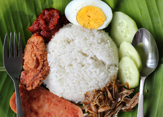 Nasi Lemak or Coconut Milk Fragrance Rice is a dish originating in Malay cuisine that is commonly found in Malaysia and Singapore