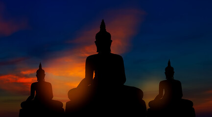 Silhouette of buddhas on golden sunset background buddhism beliefs