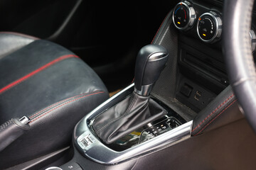 Automatic gear stick inside modern sport car. Luxury and expensive concept.