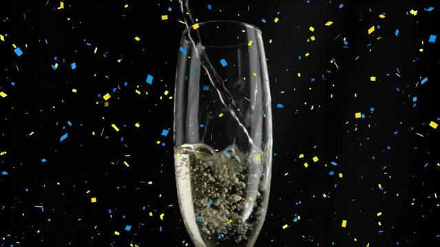 Animation of confetti over glass of champagne