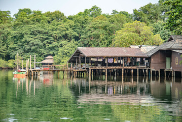 Fototapeta na wymiar Houses along the canal out to the sea in the mangrove forest on Koh Kood, Trat Province, Thailand.