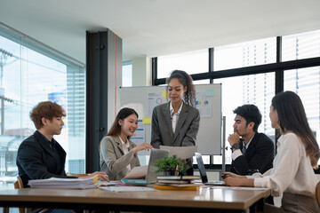 diverse business team people discuss financial result review paperwork share ideas brainstorm collaborate work in teamwork at group briefing table.