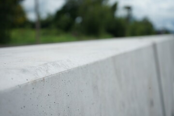 concrete barrier To prevent cars crossing the lane to collide (blurred image)