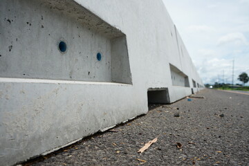 concrete barrier To prevent cars crossing the lane to collide (blurred image)