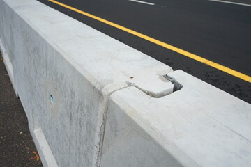 concrete barrier joints on the island in the middle of the road